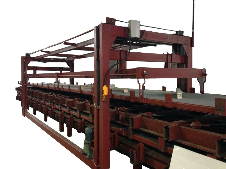 Intermittent press output station — finished cold-room sandwich panel exiting onto take-off conveyor