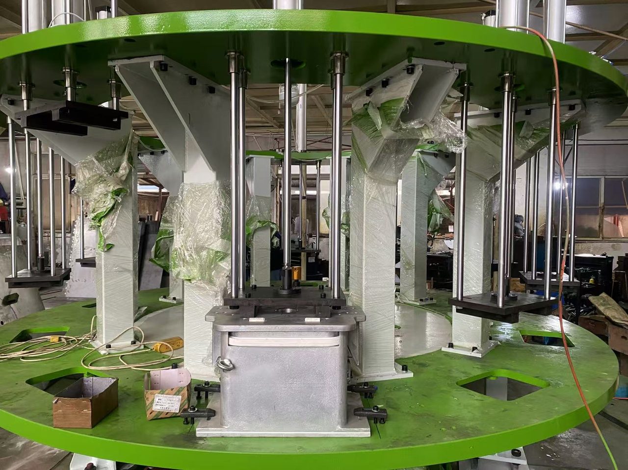 Rotary carousel — 12 jig positions, vertical guide columns, central service tower
