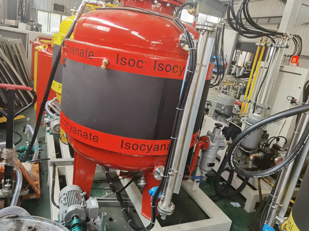 Jacketed day tanks for polyol and isocyanate, on the production floor