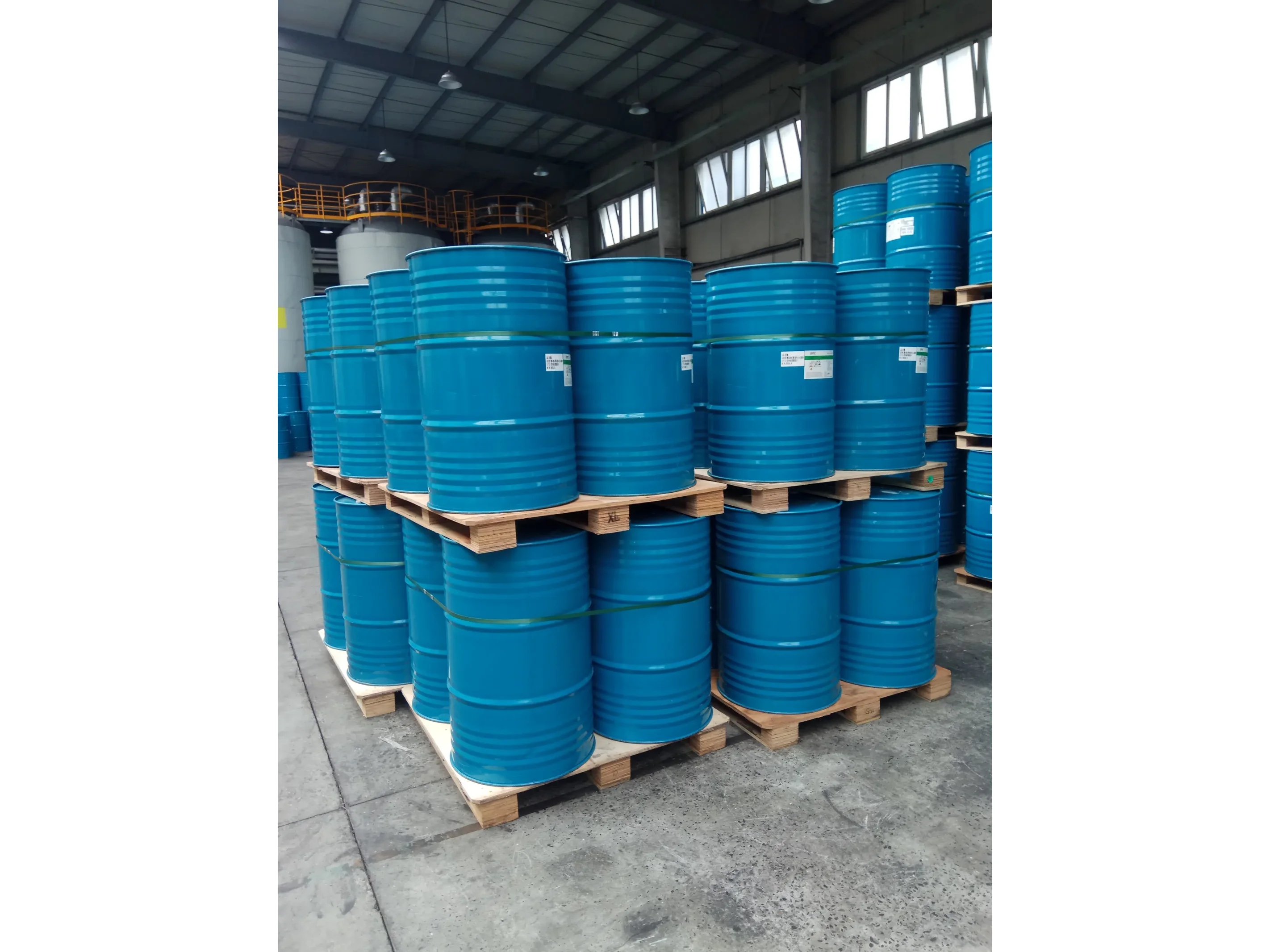 Polyol and isocyanate raw material drums in warehouse